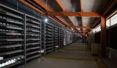 Massive Bitcoin mining farm showcasing rows of mining machines